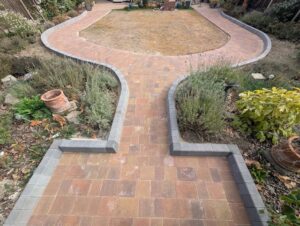 Completed curved block paving path around the Bexley garden lawn