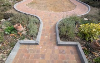Completed curved block paving path around the Bexley garden lawn
